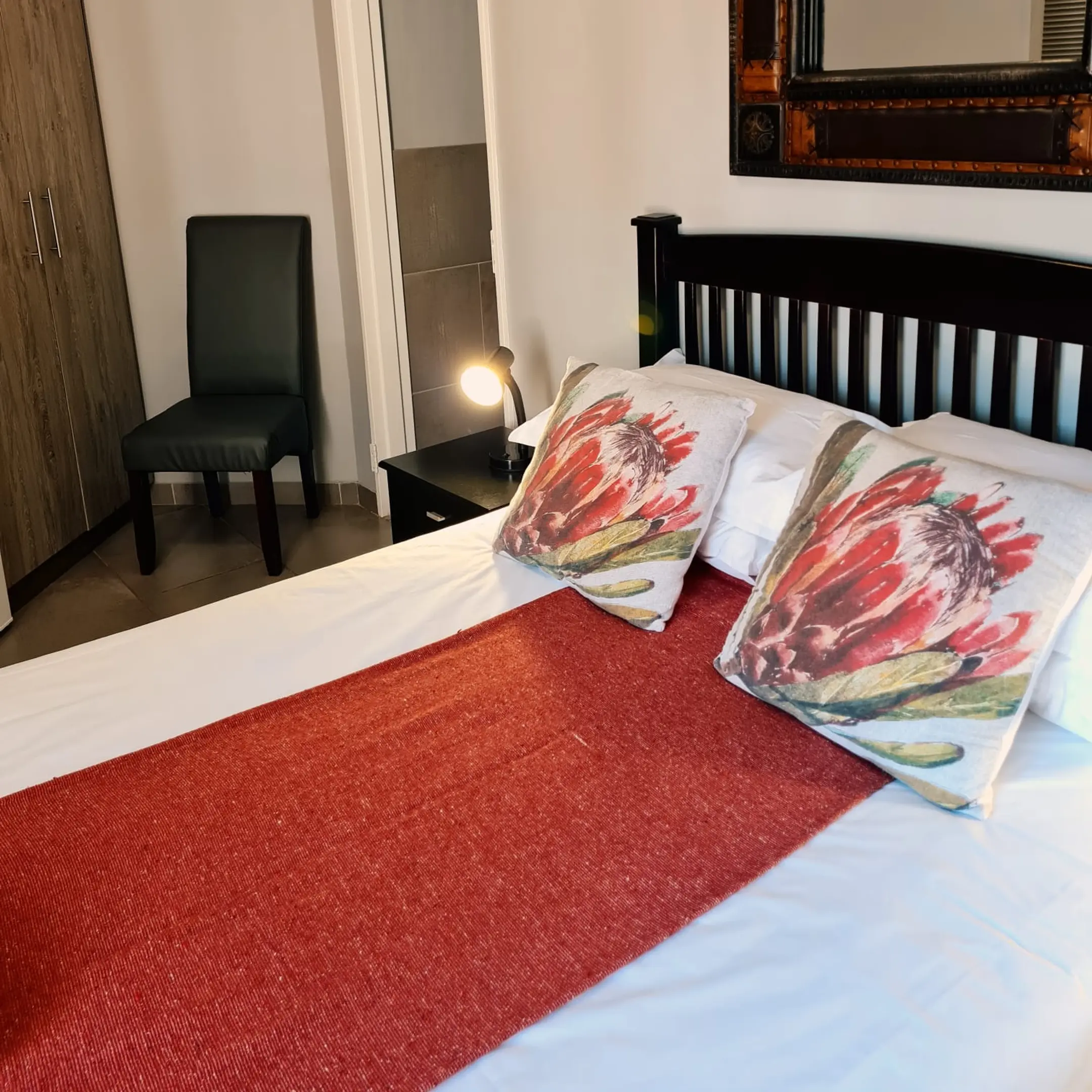 Bed with red throw