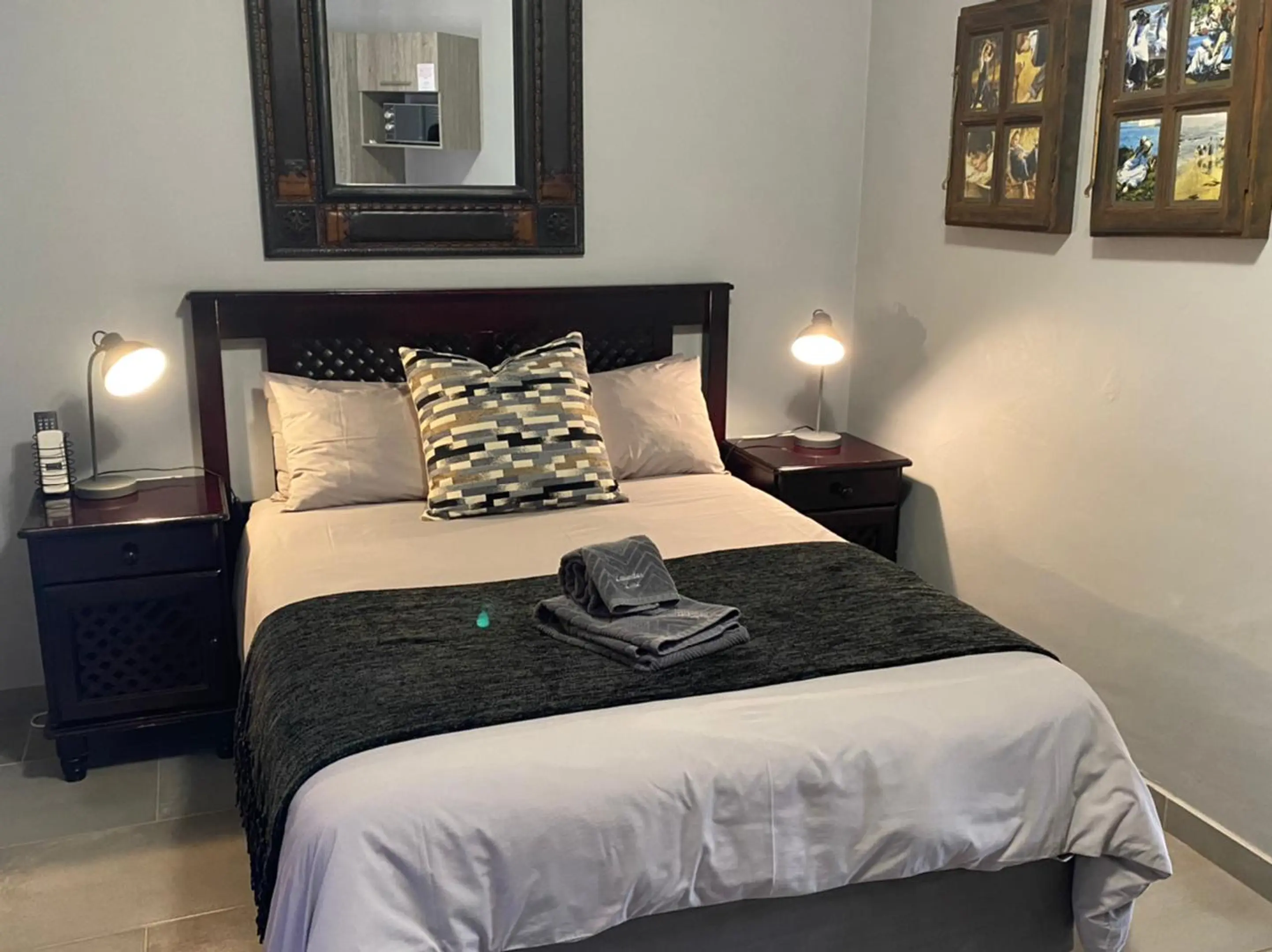 Double bed with grey throw